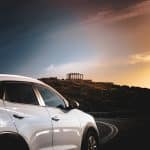 white car on road